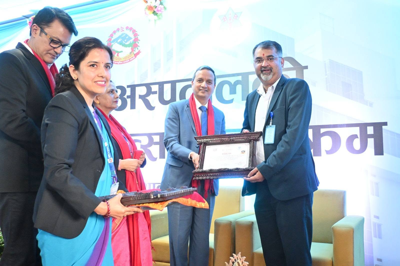 Dr. Deepak Kumar Mishra receiving Bir Hospital 137th Annual Day Prashansa-Patra