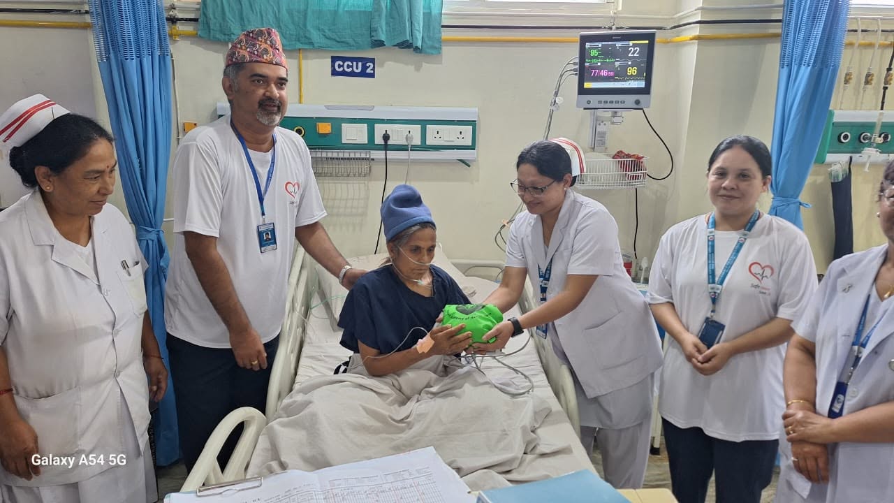 Dr. Mishra visiting patient with medical team